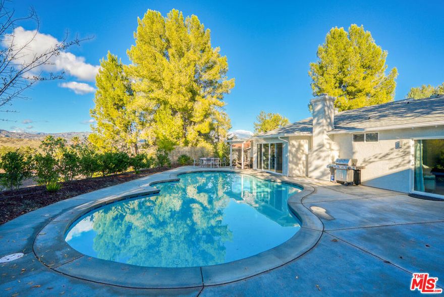 WEST HILLS VILLA W/ BREATHTAKING VIEW. FULLY FURNISHED, FULL EQUIPPED. AVAILABLE FOR SHORT AND LONG STAYS. Enjoy a peaceful & welcoming property on 15 minutes away from great shops & restaurants in the Commons at Calabasas! . Sparkling in-ground pool . Large kitchen & spacious living room & access to the backyard. . Tree-lined view in a welcoming neighborhood. A truly perfect home for all your entertainment needs!  The property features gorgeous drought tolerant landscaping, an oversized sparkling pool, multiple outdoor entertainment areas and the perfect setting to enjoy the unobstructed 180-degree view of the Chatsworth Reservoir and surrounding mountains. This home has been reimagined and redesigned incorporating the absolute comfort and luxury lifestyle! No expenses spared, no details grand double entry doors will lead you to the open living space, completed with blond European oak floors throughout, high ceilings, and an abundance of natural light. (No interior or exterior steps  A modern kitchen , black quartz countertops and large island with a butcher block the perfect playground for any home chef!  Adjacent to the kitchen is an elegant dining room open to a formal living room with a custom stone fireplace. ; The sliding glass doors open to the backyard and pool for a perfect indoor-outdoor living set up. The spacious family room is perfectly situated next to the kitchen offering privacy and comfort.  Down the hall to the left the 2 large secondary bedrooms and a guest bath featuring a soaking tub and high-end designer finishes. To the right you will find the ultimate primary suite, complete with a walk-in closet, a gorgeous on suite bath, and a glass sliding door leading to the back yard and expansive view. Price reflects year lease inquire about short term