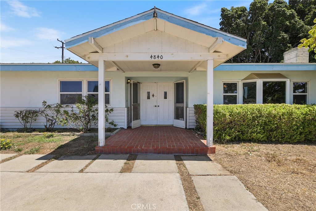 Fantastic Opportunity in the Coveted Los Coyotes Country Club Neighborhood! Perched above a charming circular driveway, this property offers endless potential for both homeowners and investors alike. Currently featuring 3 bedrooms and 2 bathrooms, the home includes formal living and dining rooms, an oversized family room, a functional kitchen, and an enclosed sunroom. Sitting on a spacious quarter-acre lot, the property also boasts a detached two-car garage and a large rear carport — providing ample parking and storage options. Whether you’re looking to renovate and create your dream home, or seeking your next investment opportunity, this property presents incredible upside. Located just about a Par 5 away from the Los Coyotes Country Club, and just moments from fantastic shopping and dining options. Opportunities like this don’t come around often — don’t miss out!