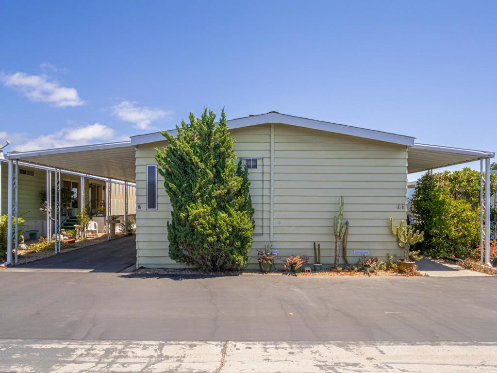 Welcome to Antonelli's MHP, a cooperative 55+ mobile home park in a great Mid-County location. This home is very spacious, 1440 sq. ft, 2 bedrooms, 2 baths, it is an older mobile home but in pretty good shape. Or perhaps, you are looking for a great location to place a new home. The lot could handle a new manufactured home. There is a large front deck, a sunny back yard space, a large workshop/storage and picturesque views from the living room windows. Newer laminate flooring in the LR, DR, & kitchen and some dual paned-windows. The park has a beautiful clubhouse, a community pool and community gardens filled with flowers and shrubs. Near Capitola, 41st Ave Mall, shopping, restaurants and beach.