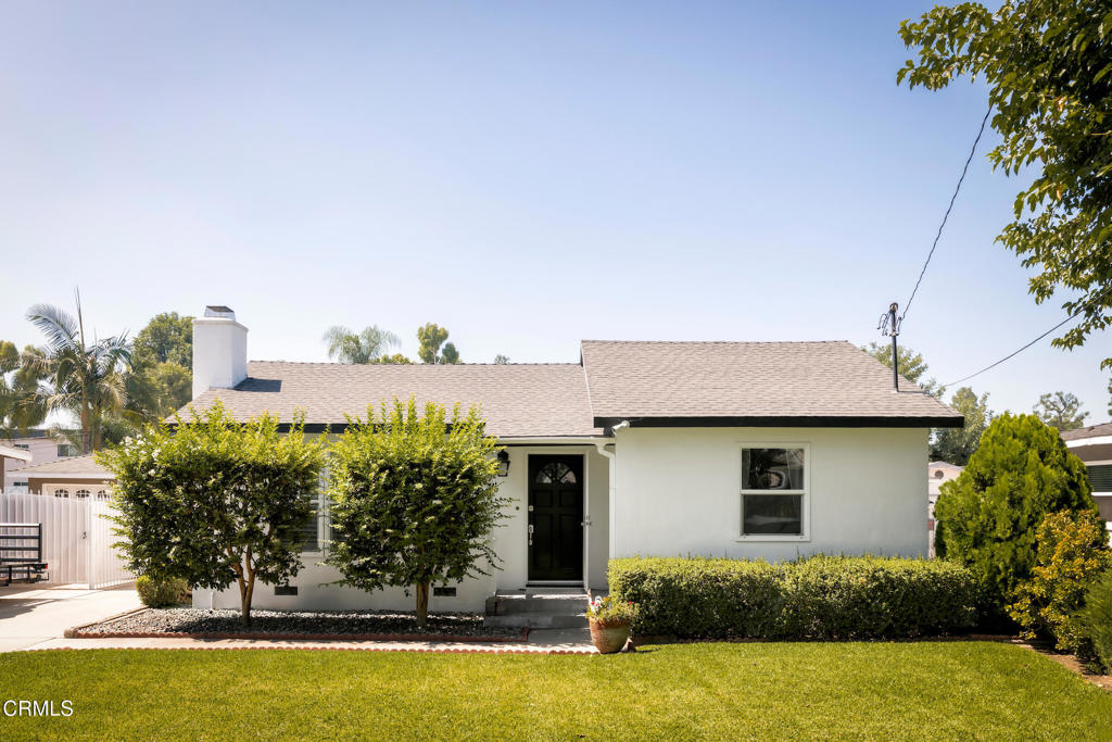 The moment you step into this charming home, you'll immediately notice how meticulously it has been cared for over the years. This 2-bedroom, 1-bathroom beauty sits on an expansive 10,406 sq. ft. lot -- offering space, light, and endless possibilities, including plenty of room for a future ADU. Sunlight fills the spacious living room and dining area, both featuring elegant custom shutters. The updated kitchen is a chef's delight, with abundant counter space, generous storage, a classic subway tile backsplash, and stainless-steel appliances. Both bedrooms are generously sized with updated windows, and the bathroom has been beautifully renovated with a dual-sink vanity and stylish finishes. Step outside and let your imagination run wild. The backyard is designed for gatherings, with multiple entertaining areas and a covered patio perfect for outdoor dining. There's even enough space to add a pool. Adjacent to the garage, you'll find a versatile bonus room -- perfect for a home office, studio, or future pool house.The property also features a two-car garage and a long driveway, offering secure parking for multiple vehicles or even an RV. Additional highlights include copper plumbing, updated electrical wiring, and two energy-efficient mini-split units. Welcome home -- this thoughtfully maintained property is ready to be loved by its next owner!