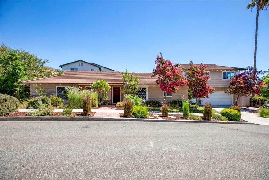 Beautiful Ranch Style 2 story estate view house in a fantastic location, located on a private & quiet  cul de sac. Over 2600 SQ FT. Qualifies for best schools in Burbank. This house has 5 bedrooms, 3 bathrooms, plus large office/studio or work room, large kitchen, hardwood floors, fireplace in living room. Gorgeous views of Universal Studios, minutes from Burbank media district. Private & Romantic side and back yards, pro-landscaped, two car attached garage with work bench area. Must see. Easy to tour.