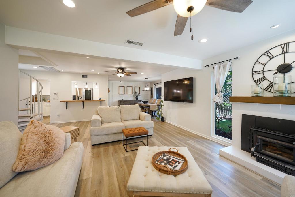 WELCOME to 23822 Green Haven Lane! This beautiful 3BD/2.5BA condo has been updated and is move-in ready. The gorgeous kitchen is light and bright with upgraded granite counters and a beautiful backsplash. The newer stainless steel appliances complete the look. Downstairs offers newer LVP flooring and a cozy fireplace in the living room with views of the backyard. The spacious laundry room is downstairs along with a 1/2 bath. The dining room can accommodate a large table and is adjacent to the kitchen and living room for a great entertaining area. The fully fenced backyard overlooks the greenbelt and is right next to the community pool/spa. Upstairs offers 3 spacious bedrooms including the oversized primary that offers views of the pool, walk-in closet and large walk-in shower. This unit offers mature landscaping in the backyard and a gate to access the greenbelt. There is a one car garage and one carport that goes with this home. Come see all this spacious and bright home has to offer! Within walking distance to the community pocket park, San Diego Country Estates golf resort, Par Lounge and Oaks Grille. Hiking and biking trails are right across the street.