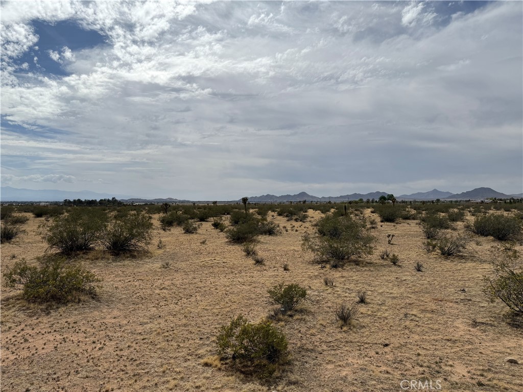 This 1.9 acre flat is in a highly desirable area for rural living. A buildable property with both city and mountain views! Yet close enough to the city for anything you desire. So, bring your imagination and build your custom dream home here where you get to experience ALL 4 seasons and fresh air.