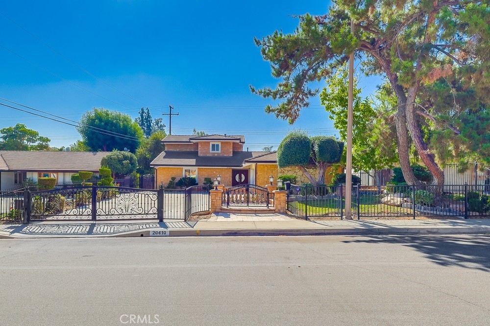 Step into the pinnacle of luxury living with this exceptional residence situated in the Walnut school district. Meticulously upgraded and beautifully landscaped, this 4 bedroom (dual primary suites), 3 bath home is one of the prettiest house in the neighborhood.
A wrought-iron gate, zen garden and gorgeous stone veneer announce the stately driveway entrance, which has been thoughtfully designed to accommodate RV and guest parking.
Double door opens to a large living room anchored by a fireplace, a built-in beverage bar, background speakers, and recessed lighting, perfect for everyday living and sophisticated entertaining.
Kitchen features upgraded cabinetry with glass cabinet display doors, built-in wine rack cabinet, granite countertop, and an adjacent laundry room. Entertain effortlessly in the eat-in kitchen with sliding door to reveal views of the backyard sanctuary.
The main level includes 3 bedrooms and 2 fully remodeled baths.
One of the bedroom is the downstairs primary bedroom suite with 2 closets, and the second bedroom is currently used as an office. Upstairs, the upstairs primary bedroom suite offers a serene retreat with wall AC and an indulgent remodeled bathroom with jacuzzi tub and separate shower, delivering a spa-like experience at home. Outside, intelligently designed backyard paradise showcases pool, BBQ grill, travertine flooring and tiered fruit-trees garden connected by a walking path behind the white fences area, perfect for outdoor entertaining.
Additional upgraded amenities include PAID-off 20 Solar panels, wall AC in upstairs masters suite, upgraded window coverings, wall-mounted remote control toilets, mirror bedroom closet doors, solar panels, roof re-roofed, tankless water heater, large tile, travertine & wood flooring throughout interior flooring. Interior plumbing was re-piped by the previous owner. This extensively upgraded property harmonizes thoughtful design, premium finishes and practical improvements, offering a rare opportunity to own a beautiful home in a premier school district. Seize the opportunity to call this spectacular property your own!
