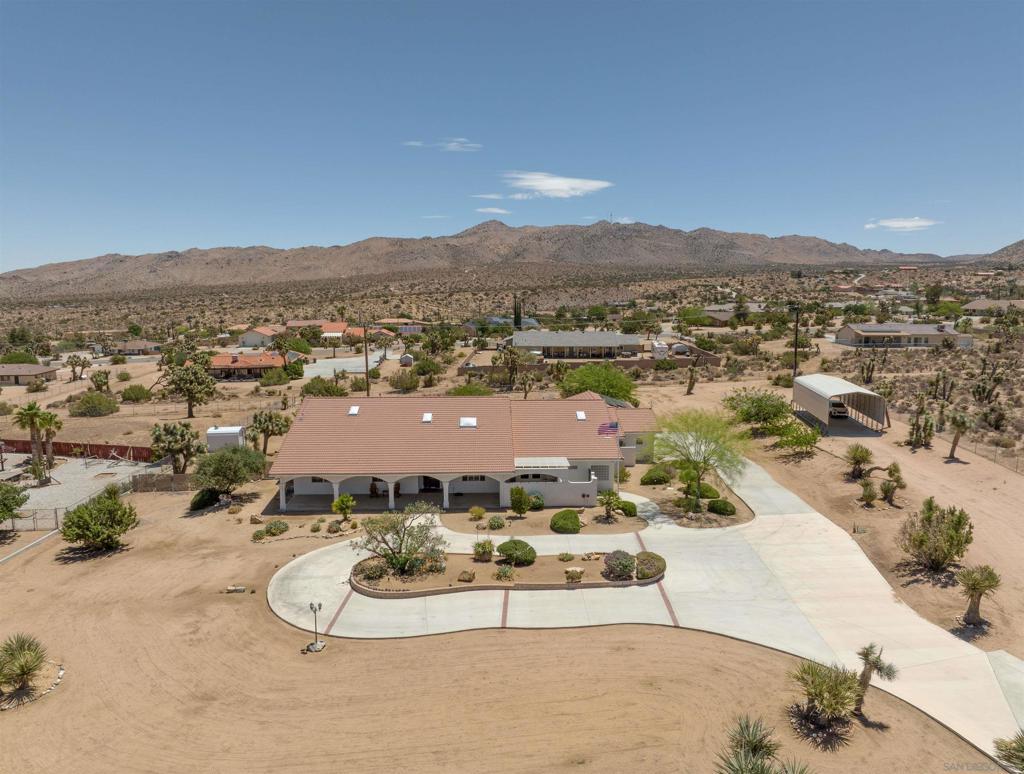 BEAUTIFUL fully renovated spacious 4 (5) bedroom 3 bath home in an amazing neighborhood in the Upper Sky Harbor of Yucca Valley! Everything you've ever wanted and needed in a home is right here. This home is situated on 1.7 acres of prime desert land, so there is plenty of room to roam and stretch your legs out. The location is also prime, only minutes away from essential amenities, shopping, schools, hiking, and the Joshua Tree National Park. The exterior features unbelievably gorgeous mature landscaping, a nice circular driveway, a 4 car attach