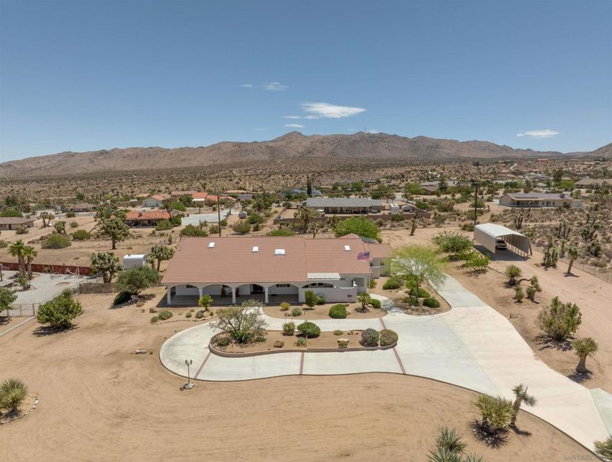 BEAUTIFUL fully renovated spacious 4 (5) bedroom 3 bath home in an amazing neighborhood in the Upper Sky Harbor of Yucca Valley! Everything you've ever wanted and needed in a home is right here. This home is situated on 1.7 acres of prime desert land, so there is plenty of room to roam and stretch your legs out. The location is also prime, only minutes away from essential amenities, shopping, schools, hiking, and the Joshua Tree National Park. The exterior features unbelievably gorgeous mature landscaping, a nice circular driveway, a 4 car attach