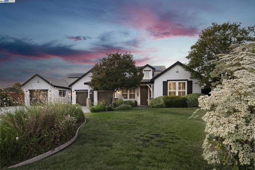 Located on a quiet cul-de-sac in one of Livermore’s most desirable neighborhoods, this beautifully updated 6-bedroom, 4-bathroom home sits on a .38-acre lot with no rear neighbors. Ideal for large or multigenerational families and those who love to entertain, the home offers a versatile open-concept layout with a spacious great room, plus an additional flex room/office with kitchenette, and abundant natural light. Oak engineered hardwood flooring flows throughout the home, adding warmth and continuity to the stylish interior. The kitchen features quartz countertops, a luxury built-in refrigerator, ample cabinetry, and a large center island perfect for gatherings. The bathrooms and laundry room have received a thoughtful glow-up, with Italian porcelain tile and updated finishes for a clean, refreshed look. Step outside to your private backyard oasis featuring a beautifully refinished pool, equipped with an outdoor kitchen, and a large covered patio-ideal for entertaining, relaxing, or enjoying warm Livermore days. A generous driveway, RV Parking, & 3-car garage provide ample parking and storage. With tasteful updates and space to grow into, this home offers the perfect blend of comfort and function and is located in the heart of wine country. Come live the LIVERMORE DREAM!!