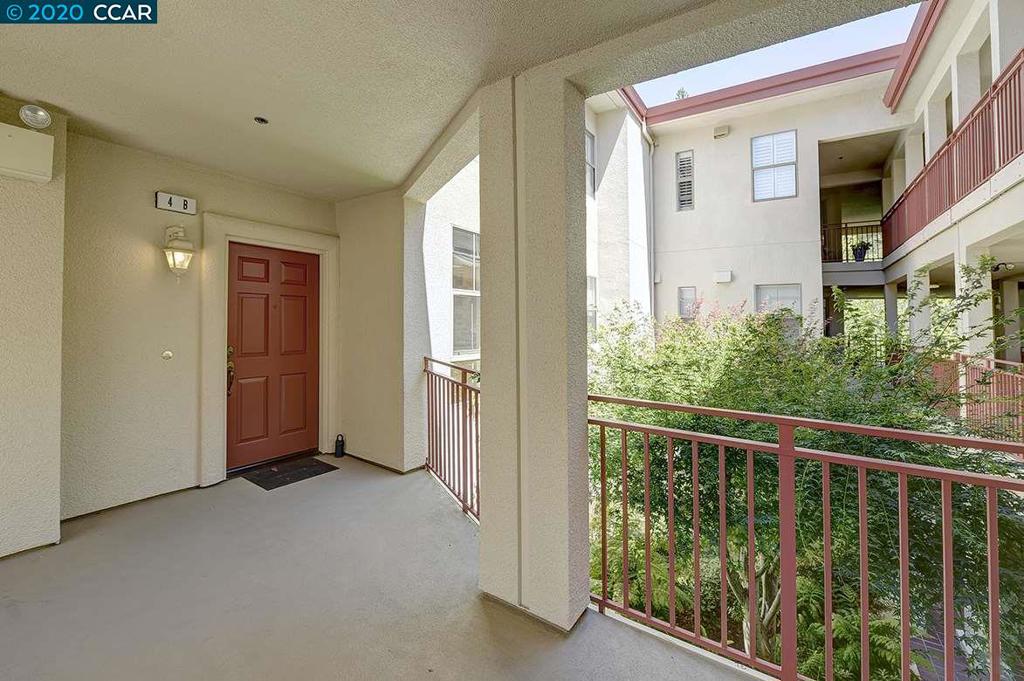 AMAZING NEW PRICE! Sellers says, "Sell this property NOW!." No steps to elegant living in this Pinnacle Ridge Woodside condo with 9' ceilings. Spacious living and dining room with fireplace and door to balcony with sylvan treed outlook. Bright large eat-in kitchen and new carpet throughout. Full size washer and dryer in hall closet. Master suite with walk-in closet, bay window and bath with double sinks and spacious shower. Please adhere to the Covid Guidelines (see associated docs).