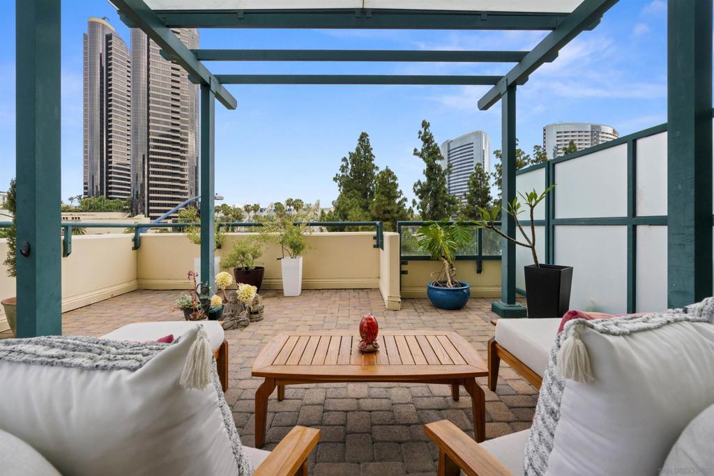 400+ SQ FT of outdoor living! Exceptional 2BR/2BA condo in one of San Diego’s most sought-after luxury high-rises in the Marina District. A rare oversized private patio offers the perfect setting for outdoor dining, entertaining, or relaxing! This bright and spacious 2 BR/2BA home features an open floor plan, gorgeous wood flooring, and abundant natural light from both southwest and east-facing windows. The modern kitchen flows seamlessly into the dining and living areas, ideal for both everyday living and hosting guests. Primary suite includes an en-suite bath and generous closet space, while the second bedroom provides flexibility for guests or home office. Enjoy resort-style amenities including a pool, spa, fitness center, 24-hour security, concierge service, guest parking, and a private storage locker plus bike storage. One assigned parking space in a secure garage is included. Just steps to Seaport Village, the Embarcadero, Gaslamp Quarter, Petco Park, dining, shopping, and waterfront trails—this home delivers the best of urban living with a rare blend of indoor comfort and outdoor space. Offered at $875,000. Don’t miss this unique opportunity in downtown San Diego’s premier neighborhood! Premium amenities: pool, spa, gym, 24 hr security, concierge, guest parking, bike and storage locker. Steps away from all that Downtown has to offer!