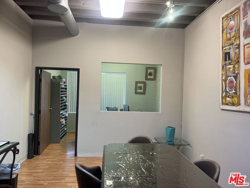Teva Leasing is proud to present a bright and spacious private office space for lease in a prime West LA (Brentwood) location. This creative office features tall ceilings with exposed ductwork, a skylight, Wilshire-facing window that fills the space with natural light. The layout includes a glass and wall-partitioned office and access to a shared conference room perfect for meetings, presentations, or team sessions. Keyless secured entry adds convenience and peace of mind. Located just west of Bundy on the north side of Wilshire Blvd, the property offers excellent access to the 405 and 10 freeways. Onsite parking in the back provides a stress-free arrival, and ample metered street parking is available for visitors. Ideal for creative professionals or teams looking for a modern, inspiring workspace.