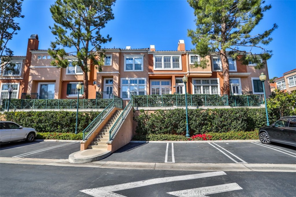 Attention All Irvine Buyers & Agents! This is One Of The Lowest Priced Gated Properties Per Square Feet, Located In Center of Irvine. This Spectacular West Park Townhouse Is In Perfect Move In Condition. Wonderfully Located Within The Highly Sought After Gated Corte Bella Community. No Mello Roos! Low HOA Fees! Highly Desired Irvine Unified School District! Incredible Townhouse With 3 Bedrooms & 2 Full Bathrooms On The Top Floor And A Huge Office With Separate Den Space On The Bottom Floor Which Can Easily Be Used As Fourth Bedroom! Marvelous Spacious Main Bedroom Suite With Soaring Ceilings, Walk-In Closet & Luxurious Spa Bath! Lovely Living Room With Apx 11 High Feet Ceilings! Fabulous Family Room! Terrific Room Sizes! Upgrades & Updates Include New Roof, Brand New High-End Engineered Wood Floor (Walnut), Brand New High-End Real Wood Shuttles For All Windows With New Screen, New A/C, New Furnace, New Water Heater, New Washer, New Dryer, New Dishwasher, New LED Lights, New Paint, And New Garage Door & So Much More! Water, Hazard Insurance, Roof With Gutter Maintenance, Landscaping, Pool With Spa, And Tennis Courts All Covered By HOAs. Great Location Near Irvine Memorial Park With Tennis Courts, Soccer Field, Softball Diamond, Batting Cages, Outdoor Amphitheater, Gardens, Tot Lot, Gazebo & Picnic Area! Must See! Do Not Miss! Irvine Living At It Best!