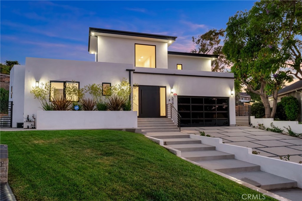 Step into luxury living with this stunning 2024-built modern residence where thoughtful design meets exceptional functionality. This 3-bedroom, 5-bathroom home features soaring 20-foot ceilings in the grand living room, a retractable chandelier, and a built-in 7-person home theatre. Outfitted with the latest smart home technology.The expansive kitchen and dining area are perfect for entertaining, featuring high-end luxury appliances, an oversized wine fridge, luxury stove with pot filler, double-wide farmhouse sink, dishwasher, oversized refrigerator, built-in microwave, and an 8-foot island with prep sink. Upstairs, the private primary suite offers a true retreat with a dedicated office, dual walk-in closets, a wet bar, peek-a-boo views, and a balcony overlooking the backyard. The spa-like primary bath includes dual vanities, a large walk-in shower with built-in bench, and premium finishes throughout. Sitting on just under 17,000 usable lot, this property offers endless possibilities — perfect for a pool/spa, ADU, sports court, or custom outdoor living space. A rare opportunity to own a fully upgraded modern home with space to expand and create.