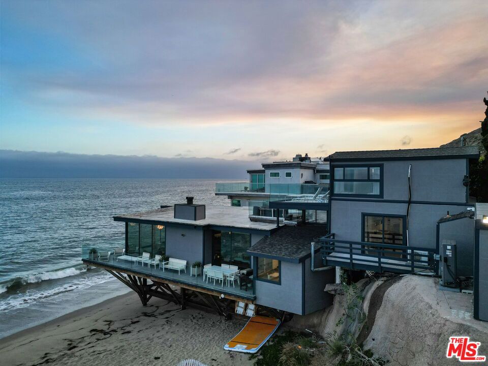 This newly renovated 4 bedroom beach house in central Malibu has wrap around decks for a 270 degree ocean and mountain views. This unique 3 story property sits on the sand and has an open view all the way down Corral Beach. The 2 bedroom, 2 bath main house sits just above beach level with direct beach access. Plus, above there is a 2 bedroom 2 bath, 2-story attached guest house. All contained within an ultra private compound with parking for appr. 4-5 cars. Chic luxury awaits you. Chef's kitchen, primary bath of your dreams and a huge open floor plan with dining room, great room and sitting room , of course ALL with floor to ceiling glass doors and views of the Pacific.