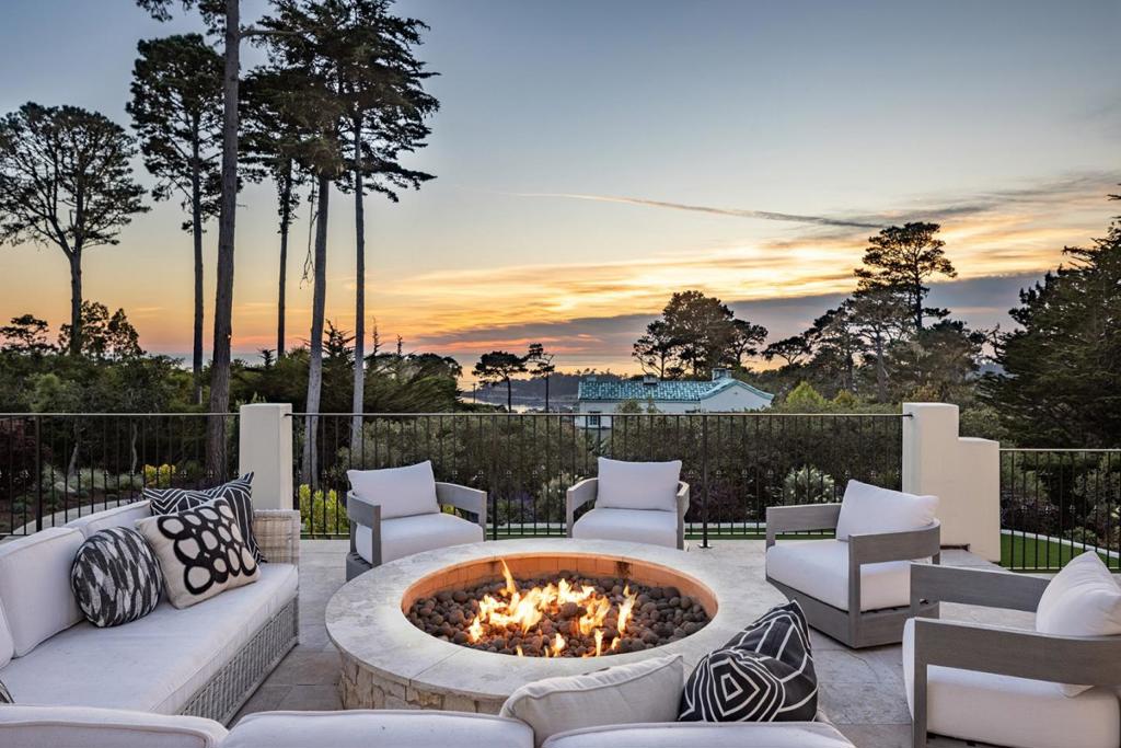 Introducing the epitome of luxury coastal living: located just above the Lodge in Pebble Beach, this exquisite 5-bed, 5 full/2 half bath home exudes elegance and charm. Bathed in natural light, the expansive modern floor plan boasts breathtaking ocean views from most rooms. Renovated in 2019 with top-of-the-line finishes and meticulous craftsmanship throughout. The landscape underwent a complete transformation in 2022-3, creating beautiful usable outdoor spaces, vegetation and pathways that allow you to take advantage of the entire property. Host dinner parties in the formal dining room or step outdoors to the grand ocean view terrace with fire pit. Features include an elevator that services all 3 levels, a large primary suite with spa like bathroom and executive office, and a gym with direct access to a hot tub, cold plunge, and sauna. This private and gated residence is just minutes to the amenities of downtown Pebble Beach, The Lodge, Stevenson School, The Hay, and downtown Carmel.