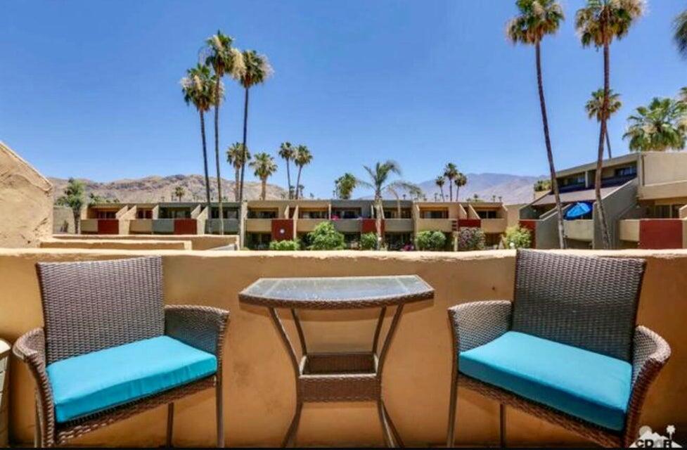RENTAL AVAILABLE FOR 1 YEAR OR LESS. FULLY FURNISHED.This AMAZING VIEWS furnished 1-bedroom, 1-bath condo offers stunning mountain views in the highly desirable South Palm Springs area. As an end unit, it features an additional window that floods the space with natural light. The updated open-concept kitchen overlooks the spacious living and dining areas. The generously sized bedroom and bath include soft-close cabinetry and modern finishes. Enjoy your private balcony, which provides secure access to a shortcut leading directly to the pool, clubhouse, walking trails or laundry. Experience the beautiful grounds of Smoke Tree Racquet Club, including lighted tennis courts, a pickleball court, bike storage, a dog park, covered parking(carport), community laundry rooms, and a sparkling pool and spa! Pool/Spa are steps from your balcony.