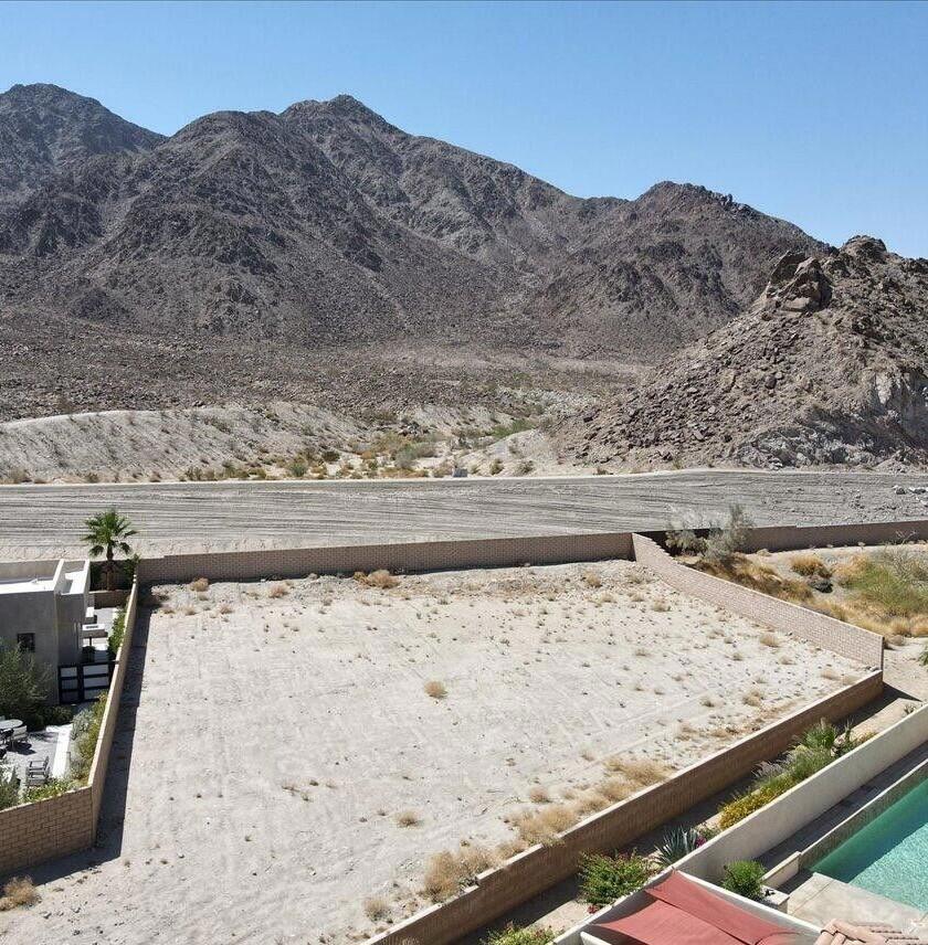 Nestled in the private gated enclave of Flores Montanas, this vacant home site offers panoramic views of mountains and vistas. This exclusive gated complex features 19 home sites. Great opportunity for a custom home away from traffic and noise. This exceptional 16000+ sq ft lot has a serene location. This premium home site will allow extensive outdoor living in a luxury home environment. Located adjacent to the Yucatan Cove. A short distance to Olde Town for dining and entertainment. Take advantage of this opportunity to purchase a custom home site with low HOA dues at a bargain price.