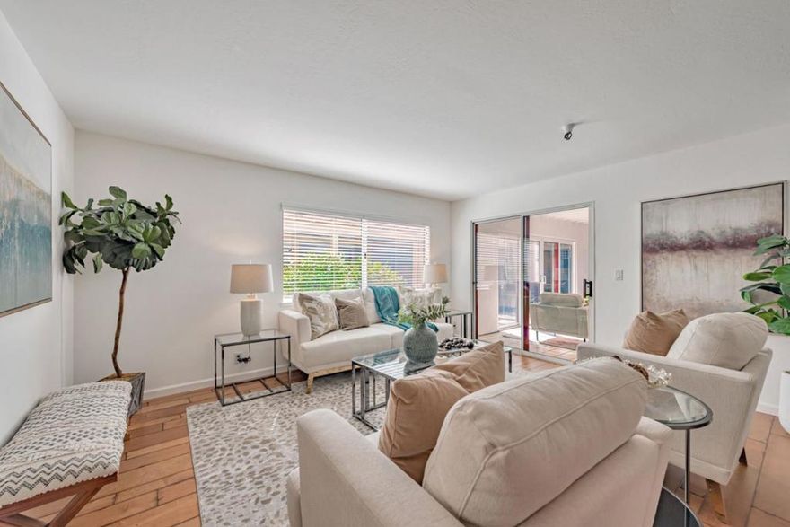 Welcome to the coveted  2 bedroom, 2 bathroom condo located in Los Gatos Commons, a resort style 55+ community.  This ground level , 1136 sq ft. corner unit is convenient and has easy access.  The spacious open living area greets you as you enter the home and draws you to the adjacent  sunroom leading  to the private garden patio to relax or entertain. Luxurious  hardwood and carpet flooring add comfort and warmth. The spacious ensuite bedroom includes a dedicated bathroom and a wall of windows,  The additional bedroom and bathroom is ready for guests or extra living space. Both bedrooms have closets with mirrored doors and custom organizers to maximize space.  Stainless steel appliances, recessed lighting, double door pantry, granite counters, are waiting for a cooking enthusiast to enjoy  the remodeled kitchen.   Security gate entry and an electric gate for your  assigned carport  gives you peace of mind and safety.   HOA amenities include a heated pool, spa, dressing area, gym, community center, library, a pool table, ping pong table and shuffleboard to exercise or socialize.  Enjoy the vibrant Los Gatos community events, restaurants, shops and parks.  Look no further and call this your home!