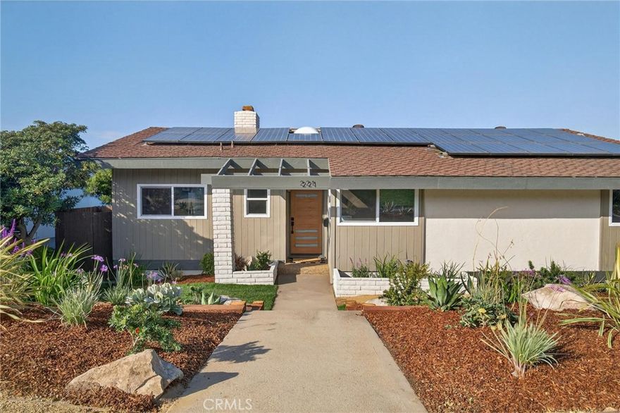 Elevated views, stunning design, and a coveted location—this fully remodeled 4-bedroom, 3.5-bathroom home in the heart of the Hollywood Riviera delivers refined coastal living with thoughtful updates throughout. Upstairs, expansive accordion glass doors blur the line between inside and out, opening the living room, dining area, and designer kitchen to a spacious deck where views stretch from the Pacific Ocean to downtown Los Angeles. The bold, modern kitchen features natural wood cabinetry, striking black quartz countertops, open shelving, and stainless steel appliances. All three top-floor bedrooms are generously sized, including the primary suite, which opens directly to the back deck and view. The ensuite bathroom features sleek, modern finishes, and every bathroom throughout the home has been fully remodeled with cohesive, tasteful design. Downstairs is a flexible extension of the home, offering a series of bonus spaces ready to adapt to your lifestyle. A spacious retreat—ideal as a second primary suite, media room, or quiet lounge—is anchored by a large bathroom with double vanities, soaking tub, and walk-in shower. Around the corner, an additional bonus area offers room for a home office, exercise space, or playroom, while the oversized laundry room brings both function and flexibility to the layout. The exterior is just as impressive, with fresh drought-tolerant landscaping in front and a peaceful backyard that features a brand-new pergola—perfect for evening relaxation or weekend entertaining. Located in one of the most desirable sections of the Hollywood Riviera, you’re just minutes from the beach, Riviera Village, scenic oceanfront trails, and award-winning local schools. This is the best of coastal South Bay living—move-in ready and designed for modern life.