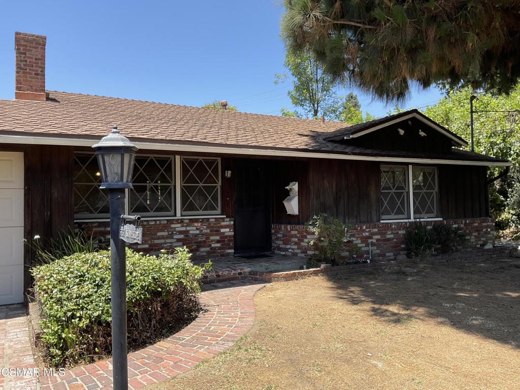 5757 Sunnyslope Ave, Valley Glen Area - Corner-Lot Fixer with Huge PotentialLocated on a desirable corner lot at Sunnyslope and Hatteras in the Valley Glen area, this 2-bedroom, 1-bath single-story home is full of charm and ready for a new vision. With great bones, a quiet neighborhood, and tons of potential, this property is perfect for investors or cash buyers looking for a true fixer.Exterior features include classic brick detailing on the driveway, patio, and below the front window, along with an attached garage that includes an aluminum garage door, refrigerator, and extra storage space. The spacious backyard offers a side gate, access to the side of the home, and plenty of greenery -- an ideal space to create a private garden or entertaining area.Inside, you'll find a brick fireplace in the living room, a dining area with a peekaboo window toward where the kitchen once was, and knotty pine cabinets still in place. A separate laundry room includes washer/dryer hookups and a built-in ironing board, but note there is no existing kitchen or water heater. Ceiling fans are installed in the kitchen area, dining area, and both bedrooms with Central Air and Heat..This is a Fantastic opportunity to Renovate and Customize a Home in the Valley Glen Area