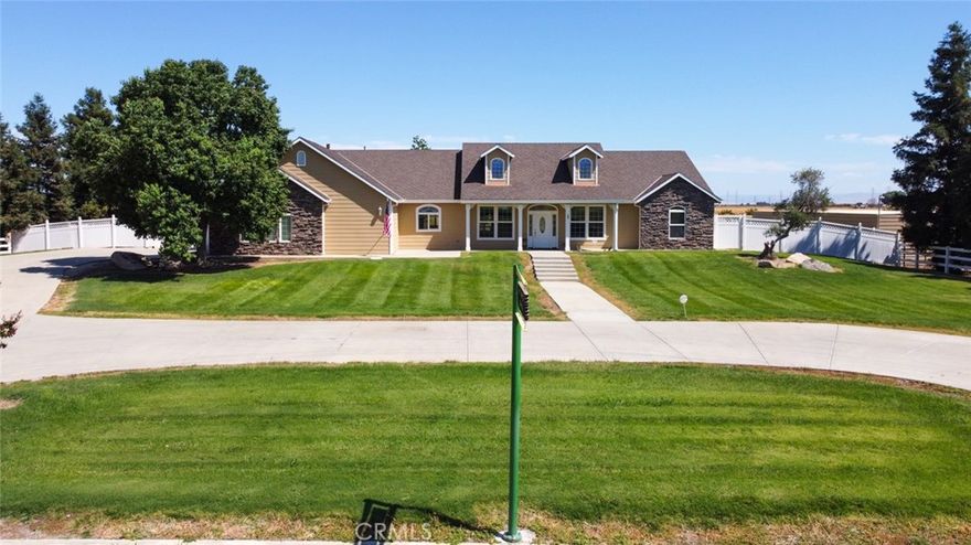 "PRICE IMPROVENT ON THIS OASIS"! minutes from town offers a Beautiful Custom Home On 4.7 ACRES- 4 Large Bedrooms, 3 Baths. plus 2x 6 exterior walls for added insulation- Formal Dining Room-large eat in Kitchen with island -  Great Room with fireplace -Wonderful split floor plan with a large Master Bed and bath with great walk-in shower- large soaking tub overlooking cozy fireplace  - large walk in closet- double sinks-wonderful laundry room with additional storage and access to outside- Lots Of Custom Woodwork thru-out house. Wonderful Eat-in Kitchen with Granite Counters, Island, Double Ovens, large circle driveway-  AND the added option of being in the MID district for irrigation. - Additional pens and stalls for cows and horses -Minutes away from the new Plaza on Mission- minutes from Highway 99 AND so much
