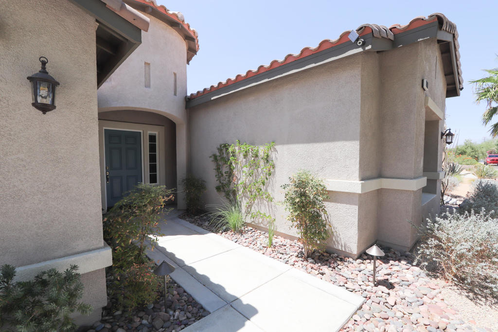 Spacious one level 5 bedroom (4 bedrooms and a bonus room), 3 bath home offering 3,015 sq. ft. of open living space in the gated all-age community of Mountain Gate. Features include tile and laminate flooring throughout (no carpet), walk in showers, a two-way fireplace in the living and bonus room, upgraded kitchen with quartz counters, deep sink, pantry, and new appliances. Additional highlights: laundry room with sink, covered patio, natural grass backyard with mature trees, and desert-landscaped front yard. RV parking plus 2-car garage. Community amenities include pools and spas. Minutes from downtown Palm Springs. Move-in ready.