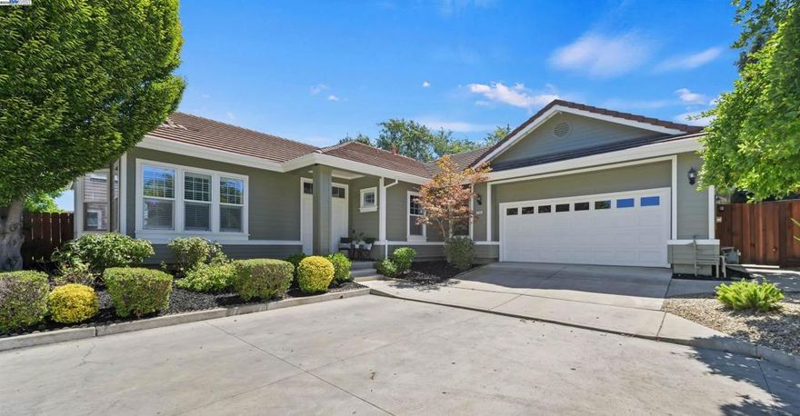 Step through the WEST FACING double front doors into a bright and spacious interior with soaring 10 ft tall ceilings. This beautifully updated home features stunning wide plank hardwood floors, crown molding, recessed LED lighting, plantation shutters, new two-tone paint, ceiling fans, and OWNED ELECTRIC SOLAR. Expansive primary suite with double door entrance, large walk-in closet, slider to the backyard, and an updated en-suite bath with separate shower and soaking tub. Enjoy indoor/outdoor living at its best with 3 sliding doors to access the huge wrap around backyard featuring two covered patios, lush landscaping, and huge grassy areas with plenty of room to add a pool, ADU, or side yard access. Desirable community with NO HOA and conveniently located with easy access nearby schools, parks, and downtown!!!