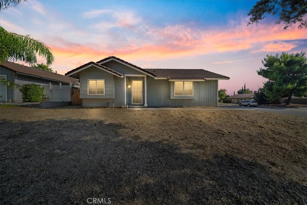 Situated on one of Redlands’ most picturesque tree-lined streets, this charming Craftsman-style home offers 2 bedrooms, 2 full baths, and 1,005 sq ft of inviting living space on a generous 6,930 sq ft corner lot. A formal step-down entry welcomes you into the great room, where vaulted ceilings and a cozy fireplace create a warm and open feel. The adjacent dining area flows seamlessly into a bright kitchen, perfect for everyday living and entertaining. The primary suite features vaulted ceilings, a wall-to-wall closet, and an en suite bath with a tub/shower combination. The second bedroom is spacious and versatile, ideal for guests, a home office, or creative space. Character details like charming grid-pane windows, central air conditioning and ceiling fans add to the home’s appeal. The expansive lot, complete with a large side gate for potential RV access, presents incredible opportunities—whether you envision adding an ADU or second unit, creating lush gardens, or designing your dream outdoor living space. This property is truly an open canvas ready for your personal touch. Located just minutes from the University of Redlands, historic downtown, Citrus Plaza, cultural landmarks like the Lincoln Memorial Shrine and Redlands Bowl, plus nearby parks and trails, 914 Gail Avenue offers the perfect combination of location, potential, and classic charm.