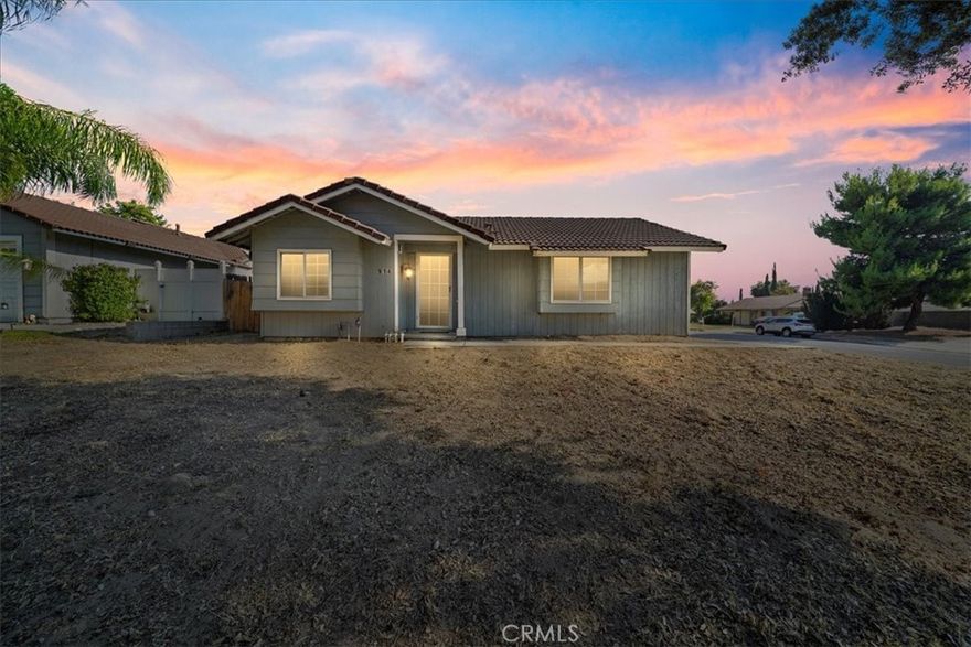 Situated on one of Redlands’ most picturesque tree-lined streets, this charming Craftsman-style home features freshly refreshed exterior paint, 2 bedrooms, 2 full baths, and 1,005 sq ft of inviting living space on a generous 6,930 sq ft corner lot. A formal step-down entry welcomes you into the great room, where vaulted ceilings and a cozy fireplace create a warm and open atmosphere. The adjacent dining area flows seamlessly into a bright kitchen, perfect for both everyday living and entertaining. The primary suite offers vaulted ceilings, a wall-to-wall closet, and an en suite bath with a tub/shower combination. The second bedroom is spacious and versatile, ideal for guests, a home office, or creative space. Charming grid-pane windows, central air conditioning, and ceiling fans add comfort and timeless appeal. The expansive corner lot, complete with a large side gate for potential RV access, presents endless possibilities, whether you envision adding an ADU or second unit, designing lush gardens, or creating your dream outdoor living space. This property is truly an open canvas ready for your personal touch. Located just minutes from the University of Redlands, historic downtown, Citrus Plaza, and cultural landmarks like the Lincoln Memorial Shrine and Redlands Bowl, plus nearby parks and scenic trails, 914 Gail Avenue offers the perfect combination of location, character, and potential.