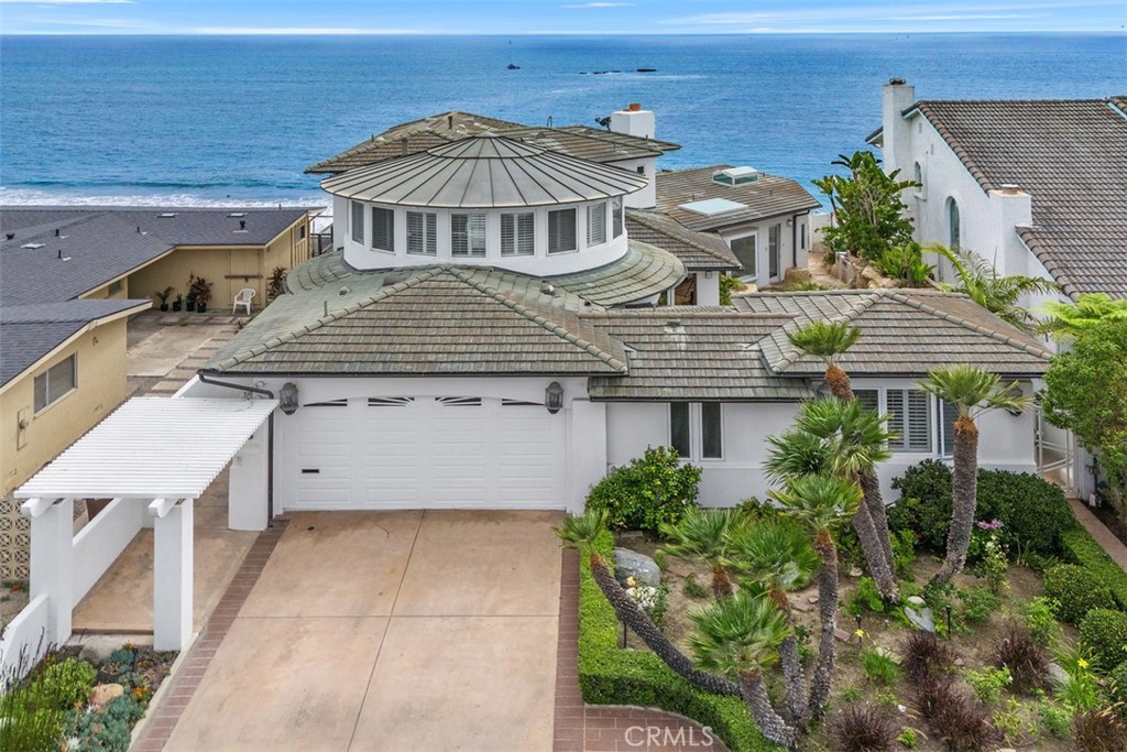 Stunning Oceanfront Estate with Panoramic Views. Exquisite sapphire-blue ocean views and sophisticated design converge in this one-of-a-kind oceanfront estate, masterfully crafted by renowned architect John Garcia, the amenities area too many to list but for one to experience. Set on a premier lot overlooking Seal Rock, Riviera Beach, and Lost Winds Beach. And captivation views of the San Clemente Pier and Dana Point Harbor, this custom residence offers the pinnacle of Southern California coastal living. Step inside to find floor to ceiling windows, a light-filled open floor plan featuring clean lines, generous living spaces, and seamless indoor-outdoor flow. The dramatic great room boasts wall-to-wall windows for amazing views of the Pacific Ocean and sliding glass doors opening to an expansive oceanfront patio with multiple levels of decks. The chef’s kitchen and adjacent sunroom/breakfast room—with wet bar—make everyday living and entertaining a breeze. The sunroom/breakfast room is accessible to the interior courtyard, providing a serene private oasis with a rock-scape pool, spa, and water elements, this room opens to another family room with fireplace and is perfect for relaxation or entertaining. The opulent primary suite occupies a prime ocean-facing position and includes a private balcony with 180-degree coastline-whitewater views, step into a spa-inspired marble jacuzzi tub with adjacent large dual head shower, also with captivating panoramic views. Two oversized secondary suites offer flexibility and privacy: one with a built-in bed, beautiful stone shower, wine fridge, and custom-built-ins. This suite is ideal for a guest retreat or executive office. The second suite also features a built-in bed, in-suite bathroom, oversized tub/shower combination and direct access to the poolside courtyard and tranquil water features. Private steps from the back patio lead directly to the sand, offering unmatched access to one of San Clemente’s most coveted family-friendly beaches—ideal for surfing, paddleboarding, swimming, or sunset strolls. All just minutes from downtown San Clemente, the pier, local dining, shopping, the train station, and the coastal amenities of Dana Point and San Juan Capistrano. NO MELLO ROOS or HOA