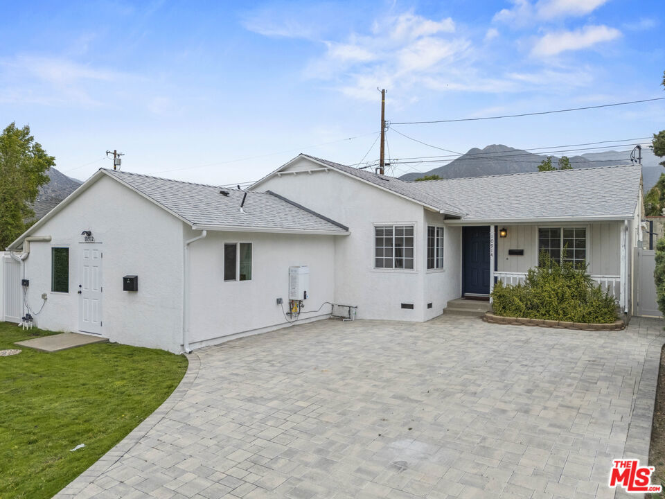 Presenting this beautiful turnkey home that features 3 bedrooms and 2 full bathrooms in the main house (est 1250 sq ft) and a converted garage with Studio and bathroom (est 350 sq ft). The master bedroom features a walk-closet and a private bathroom with dual sinks. The property features an open floor plan living/dining room, updated kitchen, central HVAC, private laundry room, recessed lighting, new flooring, updated roof, and so much more. The fenced backyard provides plenty of room for entertainment and has two gated entrances. Beautifully paved stone driveway accommodates 3 vehicles. Don't miss out on this great opportunity to cashflow while you enjoy your private space.