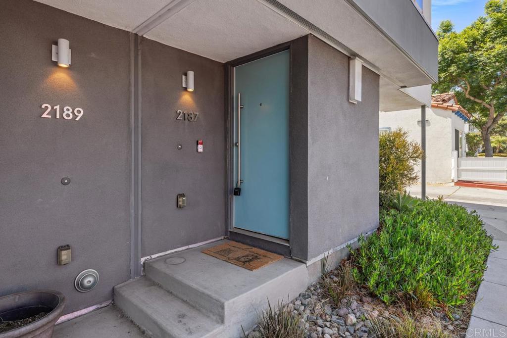 Upper Ocean Beach 2015 built townhome with a direct access two car garage and walking distance to some of the best restaurants in the area. This home features an electric car charger in the garage, first floor office space, solar paid for thru original builder, and numerous upgrades and custom finishes chosen by the seller when the home was purchased. The main living space presents with a bright open kitchen to dining to living area, perfect for entertaining. The main living space also has a half bath, laundry, and a balcony. The top floor features two primary bedrooms with two full primary baths making it ideal for either roommates or a family. Got pets? This complex has minimum pet restrictions, check it out. Walk, bike ride or drive in any direction to find yourself in beautiful Ocean Beach or Point Loma and the many parks and recreation that San Diego is so famous for. This home is in the middle of it all!!