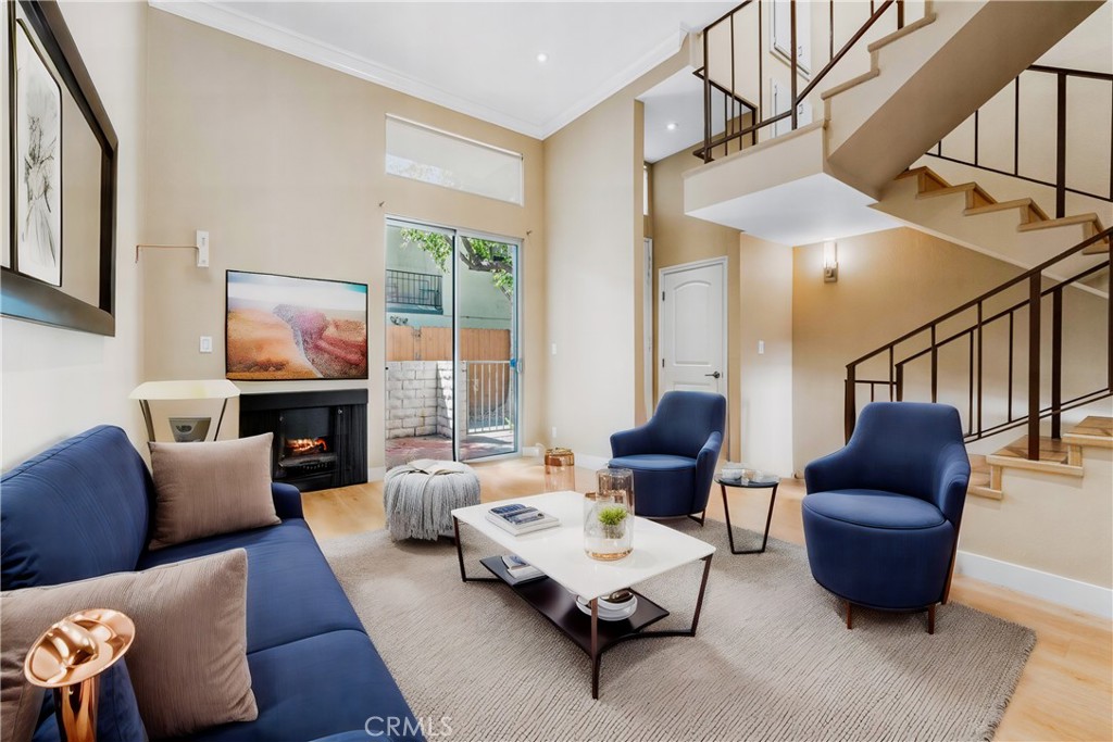 "LOCATED NEASR HOUSES OF WORSHIP,Stunning Remodeled 1450 sqft Townhome with Oversized 2-Car Garage, Gourmet Eat-in Kitchen, Spacious Primary Suite, and Resort-Style Amenities!"This beautifully remodeled townhome offers over 1,400 square feet of elegant living space. Step into a grand, light-filled interior featuring super high ceilings and stunning laminate wood floors throughout. The oversized 2-car garage provides ample storage and convenience. The large, eat-in kitchen is a chef's dream, boasting stone countertops, custom soft-close cabinetry, and recessed lighting, perfect for both everyday meals and entertaining. Adjacent is a formal dining area, ideal for hosting family and friends. The spacious primary suite includes a large walk-in closet, offering generous storage, and a luxurious, remodeled en-suite bathroom. Two additional bedrooms provide ample space, each thoughtfully designed for comfort and functionality. Enjoy your private open patio, perfect for relaxation and outdoor dining. Additional amenities include a community pool, hot tub, and recreation room, making this townhome not only a place to live but a lifestyle to enjoy.