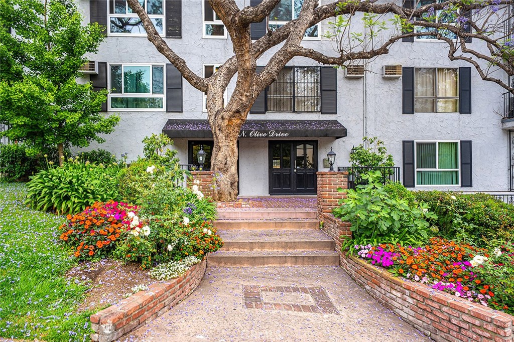 Welcome to 1222 Olive Drive #311. This spacious one bedroom, one bathroom condo includes 793 square feet of well appointed living space as well as two dedicated, covered parking spaces and is located in the vibrant community of West Hollywood. The secure Olive Manor building is located on a peaceful, tree lined street and the dues for the building conveniently maintain the unit's electricity, gas, water and trash. The Olive Manor offers a plethora of amenities including a pool, gym, sauna, community room, laundry area, gated and covered parking, secured access as well as camera surveillance for additional security. The home offers a unique opportunity to own a relaxing home retreat while being only steps away from both the iconic Sunset Strip and Santa Monica Boulevard. Entering the unit you are greeted with an open living area accentuated by an abundance of natural light, bamboo flooring, recessed lighting, and a large slider door opening to a charming and elegant balcony as well as the surrounding nature creating a lovely treehouse effect. The living area flows seamlessly into the kitchen creating the perfect space to cook and entertain. The kitchen features updated tiling, an ample amount of cabinetry and counter space as well as a passthrough connecting the kitchen to the living room. Off the living area you find the spacious primary bedroom featuring an oversized window providing a beautiful tree-lined view and natural lighting, an oversized walk in closet that can be used flexibly as an office space, recording studio, storage room, etc., an ensuite bathroom with an extra closet space, and additional storage in the form of a modern and tasteful wardrobe. West Hollywood offers some of the best dining, shopping, nightlife and sense of community that the Los Angeles area has to offer.