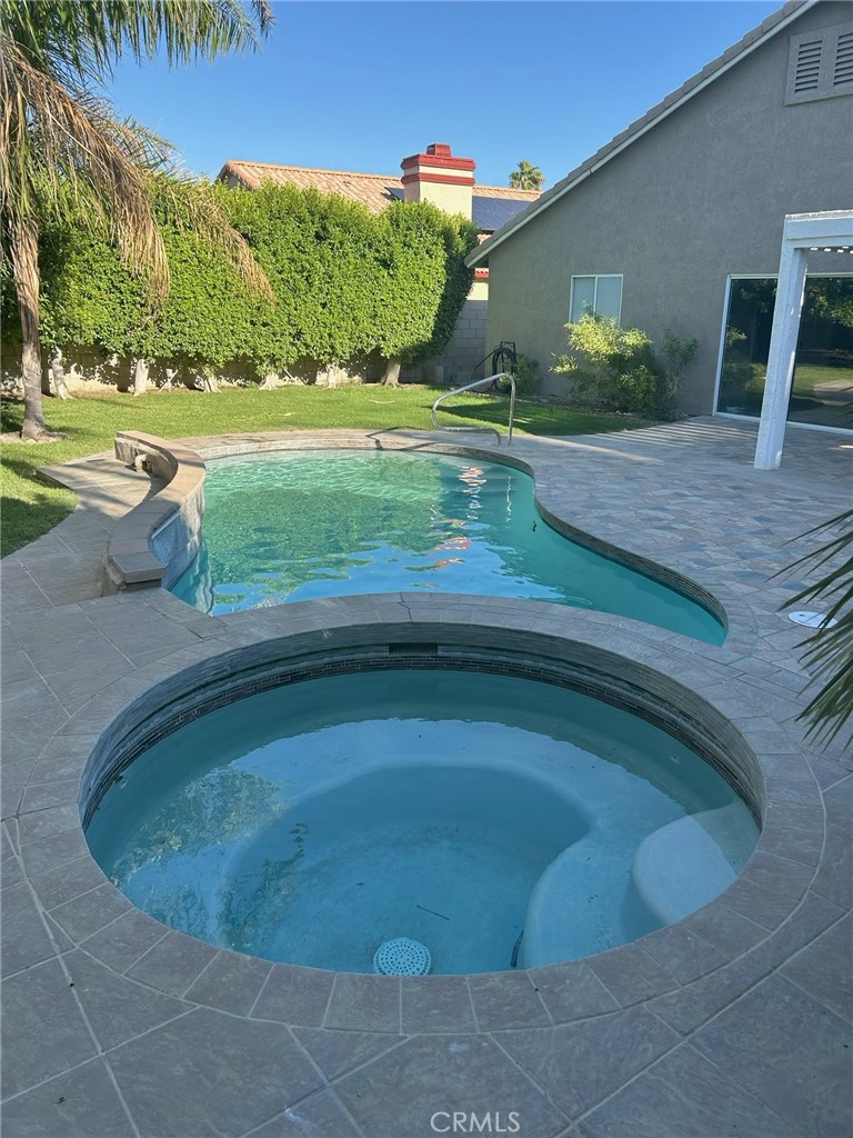 EXTRAORDINARY SOLAR POWERED HAVEN. INCLUDES A GOURMET KITCHEN, WITH MODERN APPLIANCES. AMPLE LIVING ROOM SPACE WITH ELEGANT FIRE PLACE, AND SOLAR HEATING (PAID SOLAR). PRIVATE BACK YARD OASIS WITH SPARKING SWIMMING POOL AND JACUZZI.