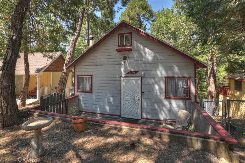 This charming mountain cabin was built in the 1930s, offering old-world character with modern upkeep. This quaint two-story cabin combines nostalgic charm with practicality. Its woodsy location and thoughtful features—like the stone tile and parking deck—make it both peaceful and functional. While modest in size, it offers warm, mountain-style living with a surprisingly accessible price point for the area.
The cabin's interior includes stone tile floors, board-and-batten walls and ceilings, and a wood-burning fireplace, giving it a cozy rustic ambiance.
Tankless Water Heater, Upgraded pipes to pex, updated kitchen and bathrooms.