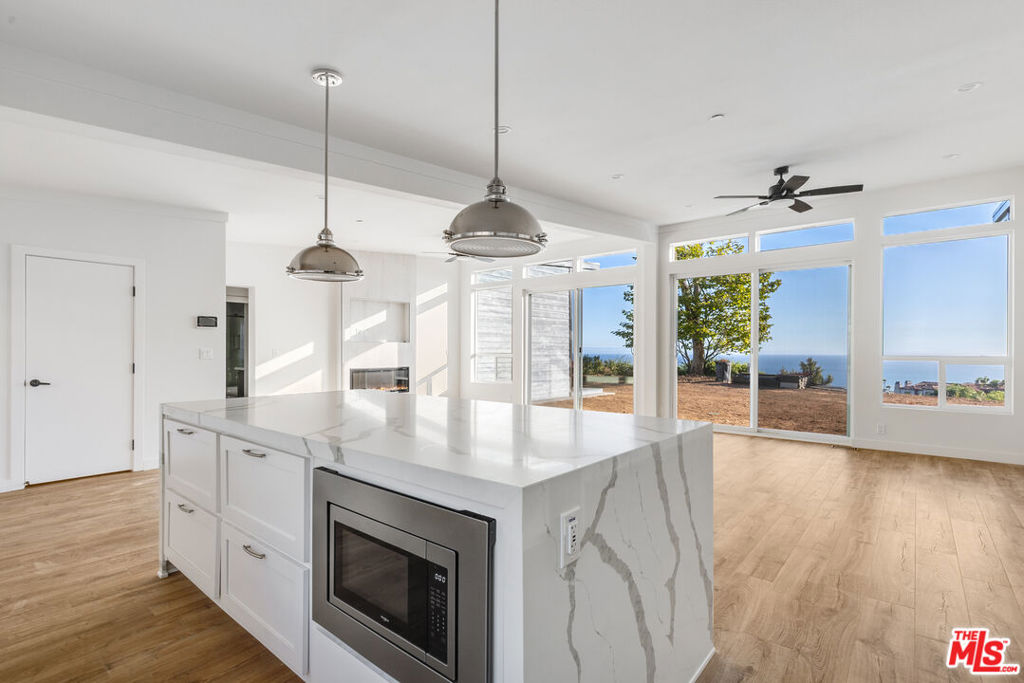 Newly built in Malibu Park, this 4 bedroom, 3 bathroom home offers sweeping ocean views and a bright open floorplan. High ceilings frame the spacious kitchen and living area, featuring quartz countertops, new stainless steel appliances with pacific ocean and mountain views from multiple vantage points. The primary wing includes an ocean view bedroom, spa-like bath with soaking tub, walk-in closet, and an additional office nursery, or bedroom. Two more bedrooms are set apart for privacy. With panoramic views from the kitchen, living room, and multiple bedrooms this home blends modern comfort with coastal beauty, just minutes from top schools, shopping, and Malibu's premier beaches. Housing provider incentives to the tenant in form of discounts to tenant on monthly rent during the first years term. Check with Agent.