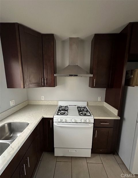 Photo of 1319 W 92nd St, Los Angeles, CA 90044 (MLS # SB26040347)