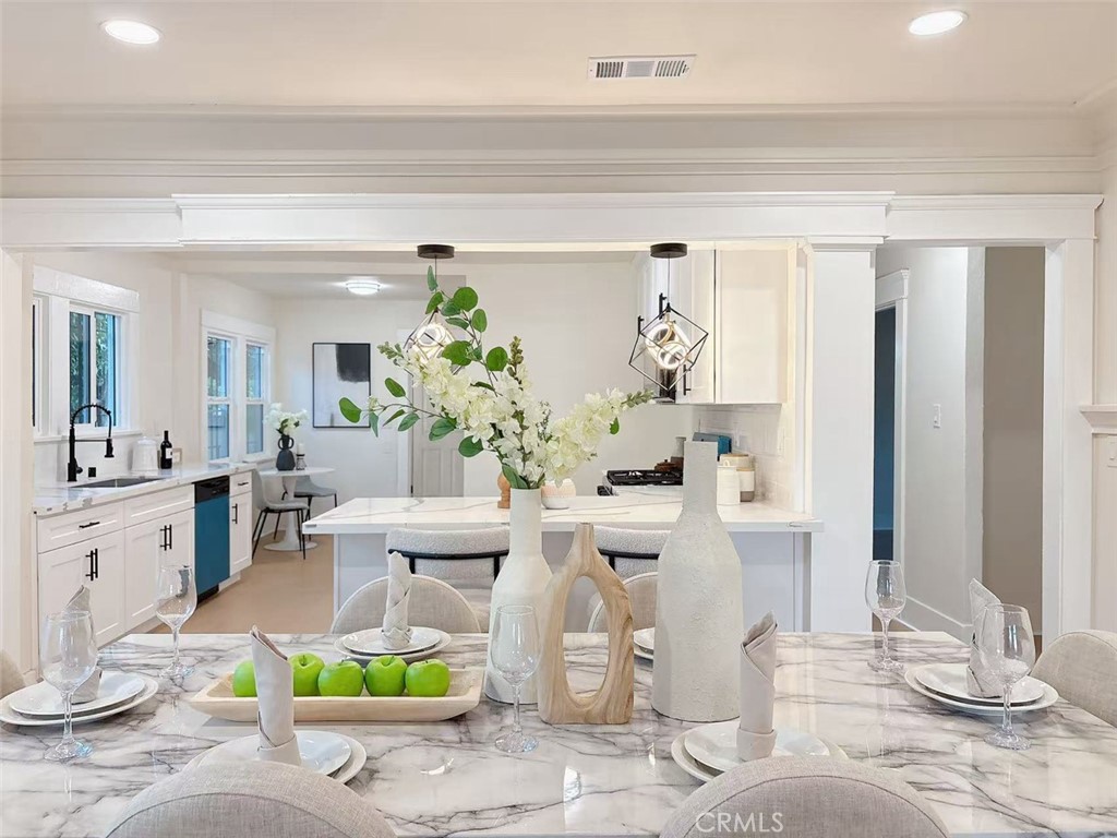 Highly upgraded and professionally designed Gated modern single level Four bedrooms, two full baths home. Central AC, upgraded flooring, upgraded baseboards, new double-paned windows and updated lighting throughout the home. The open floor plan offers a large kitchen with kitchen island and dinning room, huge living room. The kitchen offers new stainless steel appliances, upgraded stone countertops, custom backsplash and brand new custom cabinets. Ample natural light flows throughout the home. Two full bathrooms offer high standard modern touches. As a reminder the Zoning is R2!! The Nearly 6,750 Sq Ft Lot Is ADU Friendly And The Attached Oversize 2-Car Garage Is Perfect For A Garage Conversion Down The Road For Extra Income Or The Occasional Weekend Guests. . This elegant home is located in the very desirable location. Nearby is dining, shopping, entertainment, schools, parks, Metro station, Museum, USC and easy access to freeway. Great Location! This Home Has It All and Will Not Disappoint. See It Today!