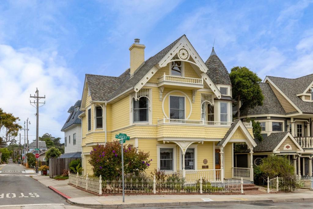 Experience timeless Victorian elegance at the "Daffodil House," a meticulously maintained 3-story residence in the heart of Pacific Grove's Retreat district. Built in 1989, this 2,316 sq ft home offers 3 bedrooms and 2.5 bathrooms, seamlessly blending classic charm with modern amenities. The home's timeless design resulted in it being the winner of the Heritage Society design award. The updated gourmet kitchen features granite countertops, new stainless steel appliances, and a central island, perfect for culinary enthusiasts. The spacious primary suite boasts an updated bath and walk-in closet, providing a private retreat. Enjoy the warmth of a gas-burning fireplace in the living room and a wood-burning stove in the family room. Additional highlights include hardwood flooring, a formal dining room, and a breakfast nook. Situated on a 2,385 sq ft lot, the property features a fenced backyard, balcony/patio, and a large 2-car garage. Located less than one block from Lover's Point, the ocean, and the coastal recreation trail, this home offers ocean views and easy access to Pacific Grove's vibrant downtown area. This is a rare opportunity to own a timeless piece of Pacific Grove's charm.