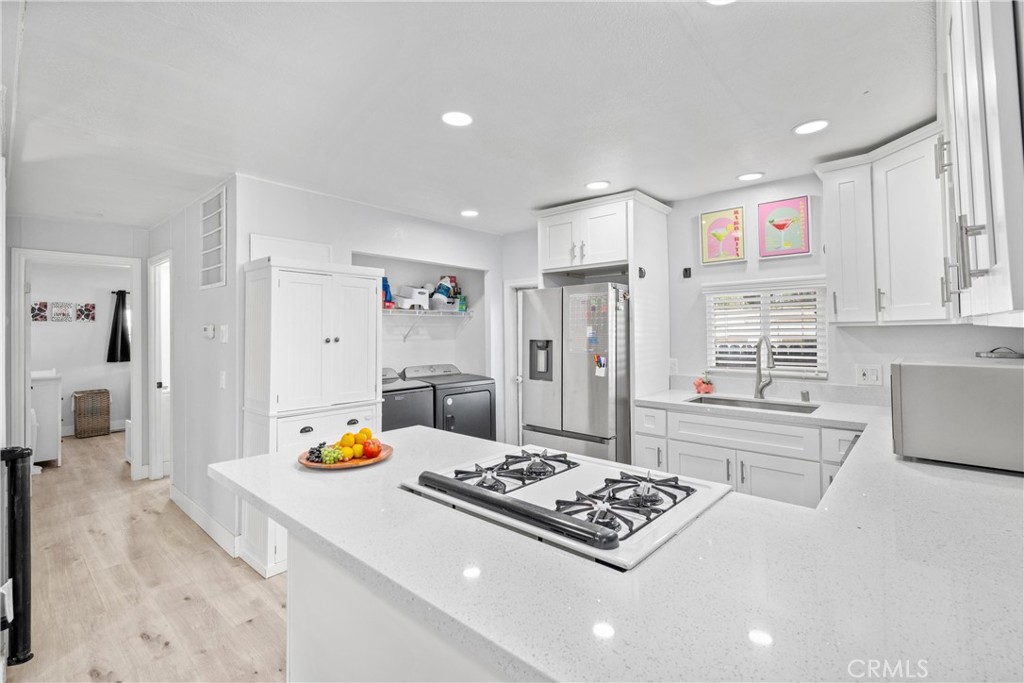 Can you believe a home THIS NICE is priced UNDER $400K? Don’t wait—schedule your showing today! This is the perfect starter home, offering both charm and functionality. From the moment you arrive, you’ll love the spacious circular driveway and deep carport with room for 5–6 vehicles, plus all your toys. A covered side patio stretches nearly the entire length of the home and leads you to a picture-perfect backyard featuring low-maintenance turf, brand new vinyl fencing, and a cozy firepit. Inside, you’re welcomed by neutral tones, updated cabinetry, and modern countertops in both the kitchen and bathrooms. The kitchen’s peninsula island creates an easy open-concept flow into the living room, perfect for entertaining or relaxing at home. The home offers 3 spacious bedrooms, including a primary suite with a private bathroom. The hallway guest bath is thoughtfully designed with a tub/shower combo and dual sinks. Conveniently located off the kitchen, the laundry area makes everyday living simple. Upgraded features throughout include dual-pane windows, keeping the home cool in summer and warm in winter. The neighborhood is charming, with surrounding homes that show pride of ownership. Plus, the high school the property is zoned for is well rated. LOW TAXES. NO HOA. AFFORDABILITY AT ITS BEST. This home qualifies for financing—reach out today to learn more!