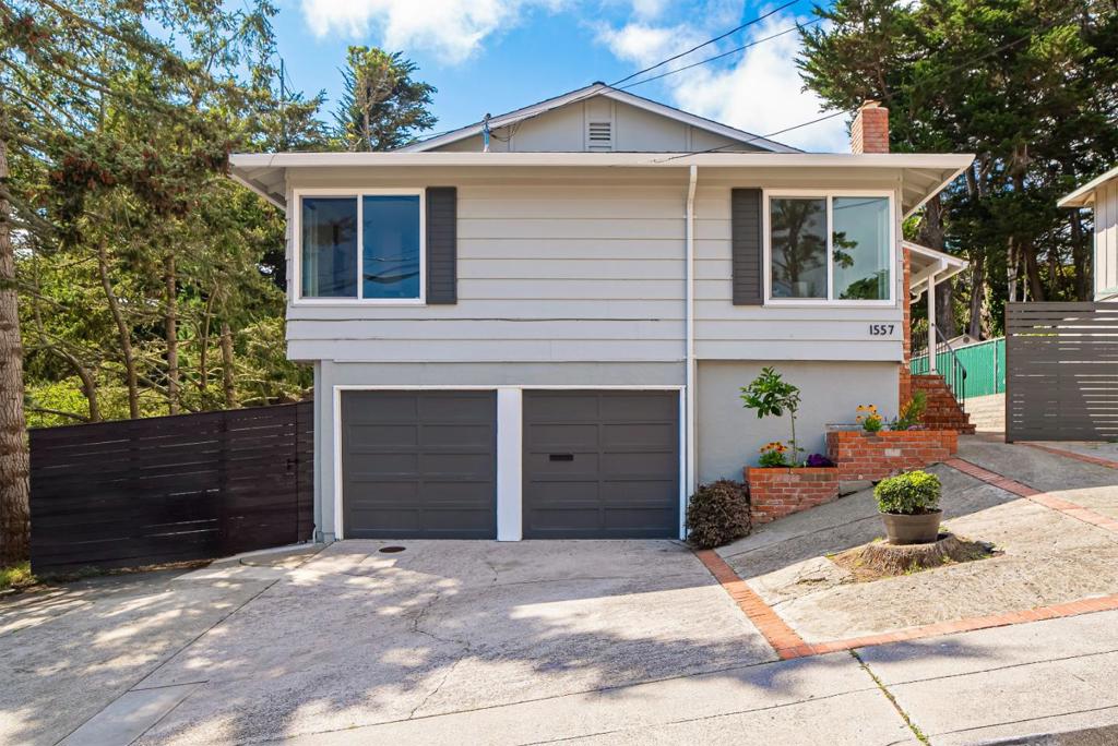 Welcome to a beautifully remodeled modern home in Pacifica, offering flexible living spaces, a prime coastal location, and an oversized lot that creates a private outdoor oasis. Updated in 2020, this two-story home includes three bedrooms and two full bathrooms, plus a bonus room with bath and a detached studio. Inside, the kitchen features quartz countertops and stainless steel appliances with hillside views from the dining area. Wood floors and large windows throughout bring in natural light, creating a bright and inviting atmosphere. The two-level backyard extends your living space with room for gardening, outdoor dining, and play. A detached studio with dual lofts and wall AC adds flexibility for a private office or flex space. There is a extra large two-car garage with Tesla EV charger. Minutes from the beach, hiking trails, and shops, with easy access to Highway 1 and I-280, this home delivers Pacificas coastal lifestyle with convenient connections to San Francisco and Silicon Valley.
