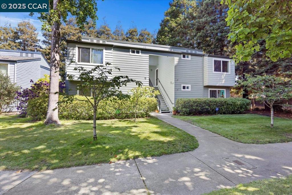 Private & serene upper corner condo surrounded by nature. Tucked away in a peaceful setting, this unit offers privacy, tranquility, and direct exterior access. Every window looks out to lush trees and greenery, creating a serene retreat from city life. Inside, the condo features spacious rooms, including a large primary bedroom, an open living area, and the convenience of in-unit laundry. The living room, kitchen, dining area, and private balcony flow seamlessly in an open layout, making it perfect for hosting guests. The owners have made numerous upgrades, such as a remodeled bathroom, plantation shutters, updated lighting, and newer appliances. The community is well-maintained and pet-friendly, providing a comfortable and inviting environment. The unit includes one covered designated parking space with plenty of additional uncovered guest parking. Ideally located near PIXAR, restaurants, shops, and easy freeway access, this home offers a rare blend of privacy and convenience. Open House 2-4pm Sunday 9/14.