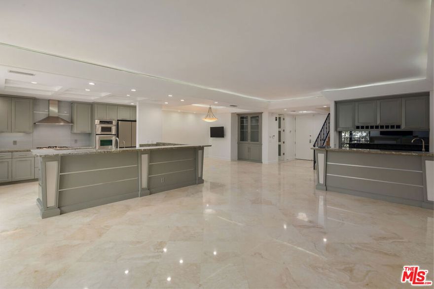 Newly renovated 2-level townhome in the heart of Beverly Hills. Bright, open floor plan with a gourmet kitchen, hardwood floors, two upstairs en-suite bedrooms, and a large private patio. Valet, front desk, pool, and spa. Full-service luxury living, steps from everything Beverly Hills has to offer.