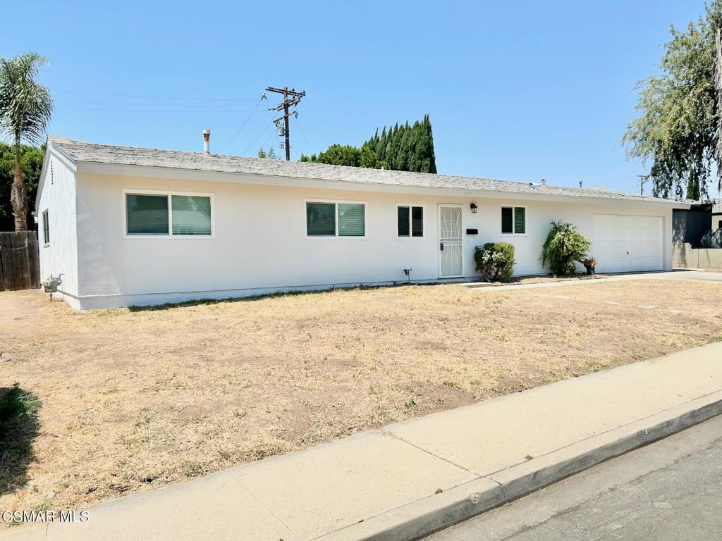 Welcome to this freshened up 4-bedroom, 1.5-bathroom home situated on a spacious 7,840 sq ft lot in a central Simi Valley location. Enter the front door and you'll find the kitchen conveniently located to the right of the entry, or head straight into the inviting living room. A powder room is thoughtfully placed near the entry, while a full bathroom down the hall offers direct access from the primary bedroom. There is direct access to the garage where your laundry area is from the kitchen. The backyard is getting a new fence along the back. Recent upgrades include new luxury vinyl plank flooring, fresh interior and exterior paint, new dishwasher, and new double-pane windows with 2-inch blinds throughout. The sliding glass door has also been replaced, enhancing both energy efficiency and style. With its large lot, updates, and prime location close to schools, shopping, and parks, this home is ready for your next chapter!