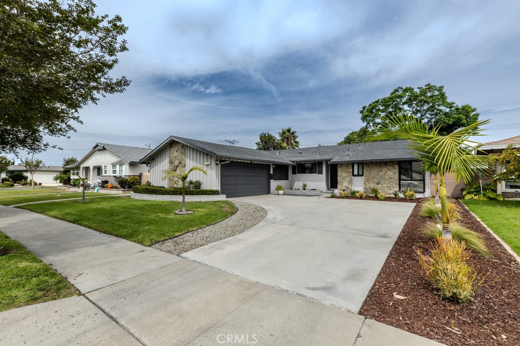 It's absolutely gorgeous, warm, inviting & has been tastefully upgraded.
4-bedroom, 2-bathroom home offers 1,836 sq. ft. of comfortable living space in a highly desirable neighborhood of East Anaheim. The remodeled kitchen features upgraded cabinets with modern finishes, granite countertops, newer Appliances and Tile flooring. Recessed lighting also extends into the kitchen, living room, dining room, and family room for a bright, contemporary feel. Freshly sanded Hardwood floors flow through most of the home, but family room as an exception. Both bathrooms have been upgraded for a modern touch. Enjoy peace of mind with a 3 years new HVAC system. Most of the upgrading have been completed in 2022. Brand-new interior and exterior paint, and fresh epoxy flooring in the garage and Laundry area in 2025. Located near major freeways 57, 91, & 55, this home offers convenient access to shopping, dining, and schools. Walking distance to Sunkist Elementary School. Close to shopping, dining, and major freeways. Just a few miles away from world-renowned attractions like Disneyland and Knott's Berry Farm theme parks, and within minutes of Southern California beaches. This amazing house could be your dream home. Stop by to see this beauty in person
Don’t miss this move-in ready gem!