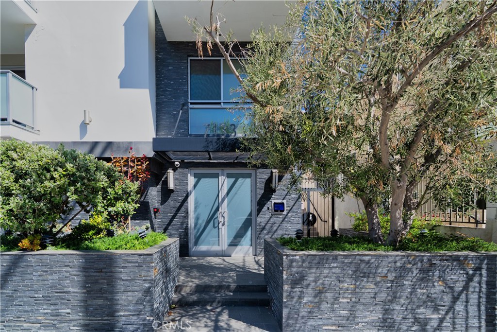 Welcome to 7133 Hawthorn Ave — a beautifully updated 3-bedroom, 3-bathroom condo nestled in the heart of Hollywood. This spacious unit offers an open-concept floor plan with abundant natural light, featuring a sleek kitchen with quartz countertops, and stainless steel appliances. Enjoy the privacy of dual primary suites, each with its own en-suite bathroom and ample walk-in closet space. 3rd bedroom & bathroom offers additional living space perfect for larger families or to use as office work space. Enjoy the convenience of an in-unit washer and dryer and unwind on your private balcony - a perfect spot for your morning coffee. Located in a secured, well-maintained complex, the building offers mobile device controlled video intercom system with controlled access. Unit included 2 dedicated parking spaces with EV charging station already installed. Live within walking distance to Runyon Canyon, Hollywood & Highland, and some of LA's best dining, shopping, and nightlife. Experience the perfect blend of urban convenience and peaceful retreat in this prime Hollywood location.