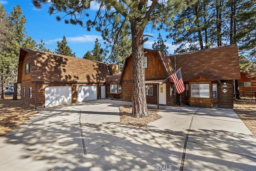 Welcome to 627 Sunset Ln — A True Mountain Retreat with the ULTIMATE Garage!
Tucked away in the peaceful Sugarloaf community, this charming cabin blends cozy mountain character with practical upgrades and plenty of space for every hobby. The star of the show is the expansive oversized garage, complete with a full workshop area and an upstairs loft/game room/man cave—the perfect getaway spot for relaxing or entertaining after a day on the slopes.
Step inside the inviting family room featuring vaulted ceilings with exposed beams and a classic brick fireplace, setting the tone for those crisp mountain evenings. The kitchen boasts real wood cabinetry, tile countertops, and warm rustic finishes that complement the cabin’s character.
With two bedrooms upstairs and one conveniently located downstairs, there’s room for family and guests alike. The primary suite is truly a retreat, offering a private sitting area or TV room with its own fireplace, ideal for cozy nights in.
A mudroom connects the home to the garage, providing the perfect transition space for snowy days or mountain adventures. Outside, a large backyard deck is ready for BBQs, gatherings, or peaceful mornings surrounded by tall pines.
Located just minutes from Big Bear Lake, Bear Mountain Resort, and local hiking trails, this cabin offers both tranquility and convenience—whether you're seeking a full-time home, weekend getaway, or investment property.