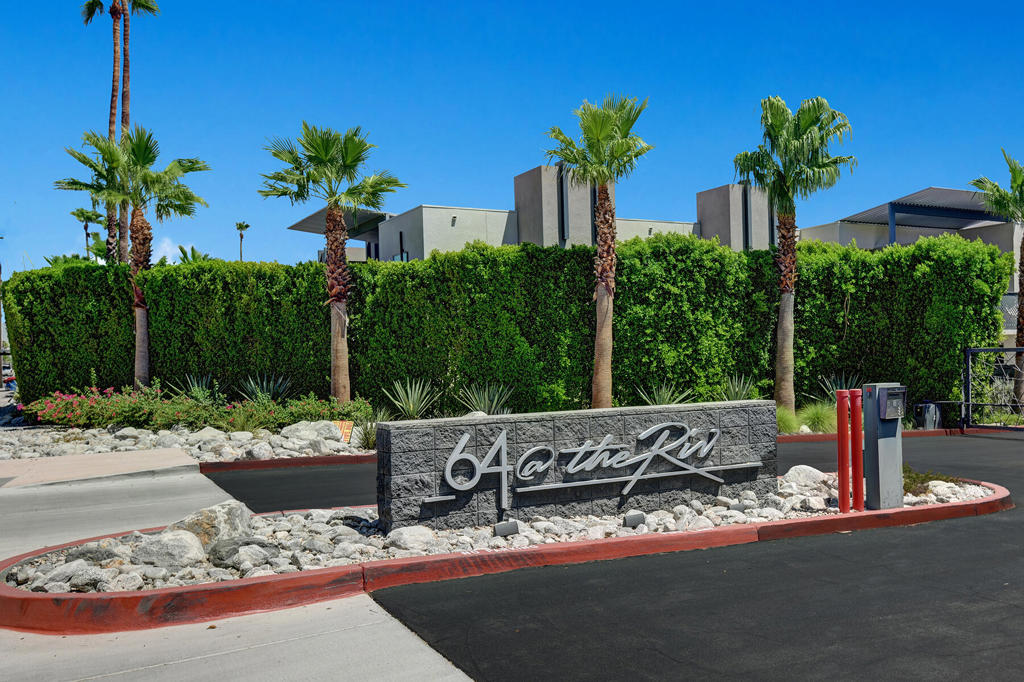 This modern 2 bedroom, 2 full and one half bath first-floor condo offers 1,500 sq. ft. of stylish living space in a gated community. Built in 2019, this home features 9' ceilings, 8' sliders, quartz countertops and a center island, stainless steel appliances, and an open floor plan filled with natural light.The spacious primary suite includes a walk-in closet and full bath, while the second bedroom also has its own full bath and direct access to a private patio with exclusive use. A separate hall bath accommodates guests. Additional highlights include an in unit washer/dryer and plenty of storage in the most amazing closet.Enjoy the main outdoor space consisting of a wraparound patio for dining and entertaining all within the privacy of your yard. Community amenities include a sparkling pool and spa, BBQ area with fire pit, EV charging station, and a dog park. Central AC blows ice cold for year-round comfort.64@TheRiv is conveniently located near shopping, dining, and local attractions that downtown Palm Springs offer.