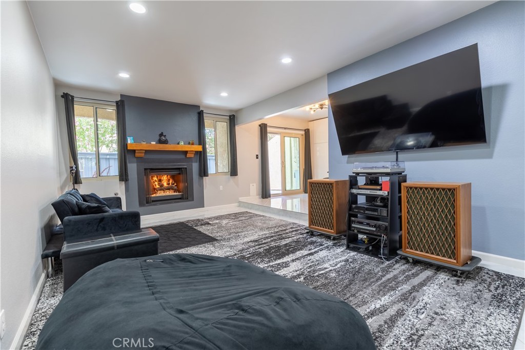 Pride of ownership shines throughout this beautifully remodeled end-unit home! Don't let the address fool you, this property is NOT ON THE MAIN STREET. Step into a spacious, chef-inspired kitchen featuring sleek stainless steel appliances, modern cabinetry with abundant storage, luxurious quartz countertops, and more—perfect for culinary creativity. NEW central HVAC system installed in 2023! AC has only been used for two weeks! The spacious primary suite is a true retreat, offering a private full bathroom and generous counter space for ultimate convenience. Each of the three well-sized bedrooms is bathed in natural light and boasts ample closet space, ensuring ultimate comfort. With two full bathrooms and one half bathroom this home provides all the space and privacy you need. Enjoy the added convenience of direct access two-car garage. Large private outdoor patio & balcony with views of the sparkling community pool and hot tub area. Best of all? No Mello-Roos fees and move-in ready, so you can settle in without delay. This private community home is located minutes from local dining, shopping, and short drive to the world-famous Universal Studios Hollywood. Don’t miss your chance to own this incredible home—hurry places like this won’t last long!