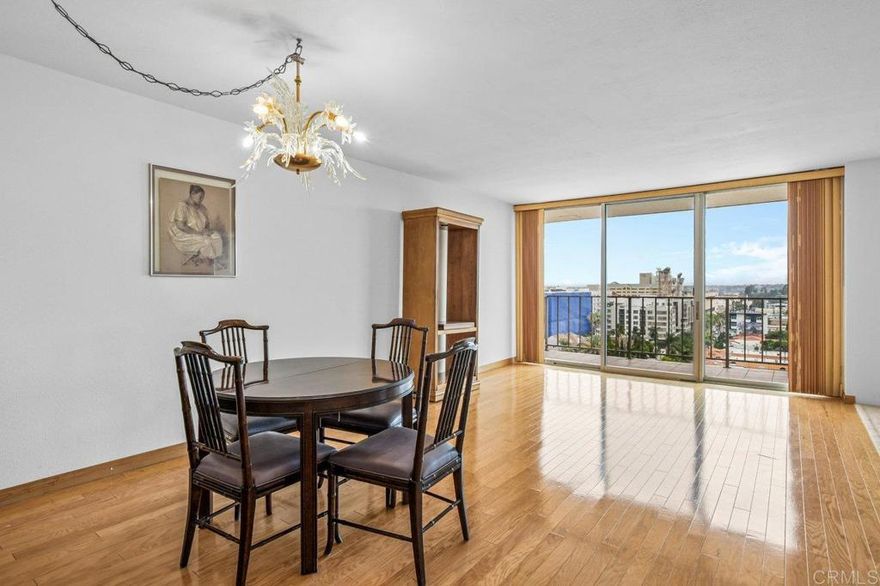 Welcome to this bright and spacious condo in the desirable Coral Tree complex, just minutes from Balboa Park and Hillcrest. Located on the 13th floor, this light-filled home showcases sweeping northeast-facing views of the mountains and city skyline. The open-concept living and dining area is accented by polished hardwood floors that bring warmth and character throughout. A retro-inspired kitchen with a breakfast bar. Both generously sized bedrooms offer stunning views, with the primary suite featuring a walk-in closet and en-suite bath. Additional conveniences include in-unit laundry, full size storage room, and two side by side parking spaces located near the elevator.  Coral Tree residents enjoy resort-style amenities including a pool, spa, tennis courts, and a clubhouse with a full kitchen, fireplace, and pool tables—perfect for entertaining or relaxing close to home. This home is ready for someone to make it their own!